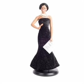 Danbury Mint "Michelle Obama" Governors Ball Porcelain Doll: A Danbury Mint porcelain doll of Michelle Obama in her black Governor’s Ball gown. The doll’s dress is black with silver spangles, and she wears black shoes and a decorative white and silver necklace. This piece is numbered “241” to bottom.