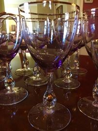 My favorite set. They are light lavender, gold rimmed, with a gold ball at the base of the stem.