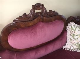 Exquisite carved wood encircles the cameo