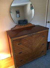 Art Deco dresser with attached round mirror