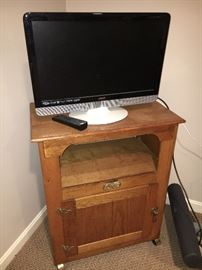 Small oak cabinet and Vizio television