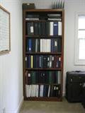 One of two wood bookcases -- with adjustable shelves...plus lottsa three-ring binders at low, low prices!