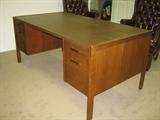 Executive wood desk w/locking lap drawer, three box drawers, one letter size file drawer