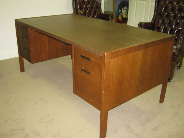 Executive wood desk w/locking lap drawer, three box drawers, one letter size file drawer