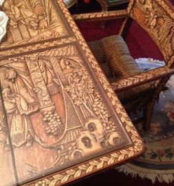 Antique dining table and 10 chairs. Heavily carved. 