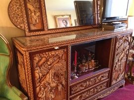 Antique Asian console with side cabinets and drawers.