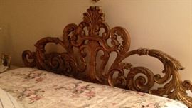 Cast metal headboard with king boxspring and mattress. 