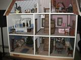 Handmade Victorian style dollhouse with handmade furniture