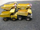Tonka trucks, some metal, some plastic