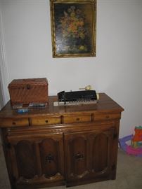Singer sewing machine in cabinet