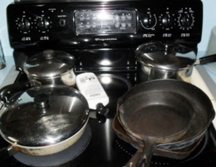Kitchen pans and skillets on Frigidaire cook stove