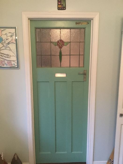 Old European door with stained glass and original hardware  and mail slot.