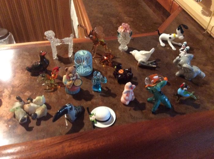 Miniature figurines, mostly glass
