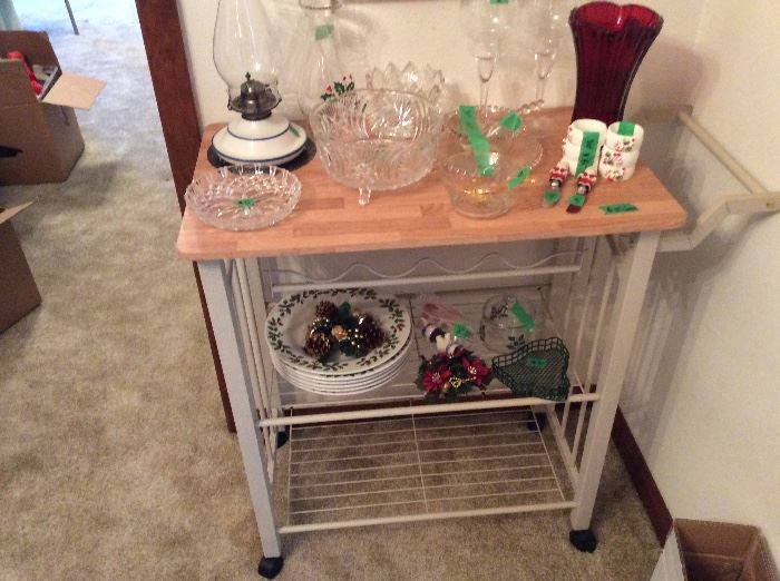 Rolling cart, miscellaneous glass items, Christmas plates, knives, napkin rings