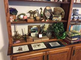 Bookshelves are packed with numerous types of collectibles, books, etc.