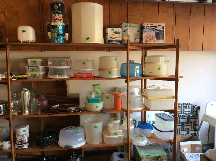 Huge shelving unit paced full of all types of items in garage