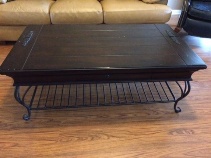 Large wood and wrought iron coffee table with hinged top for storage within, 50" x 28".