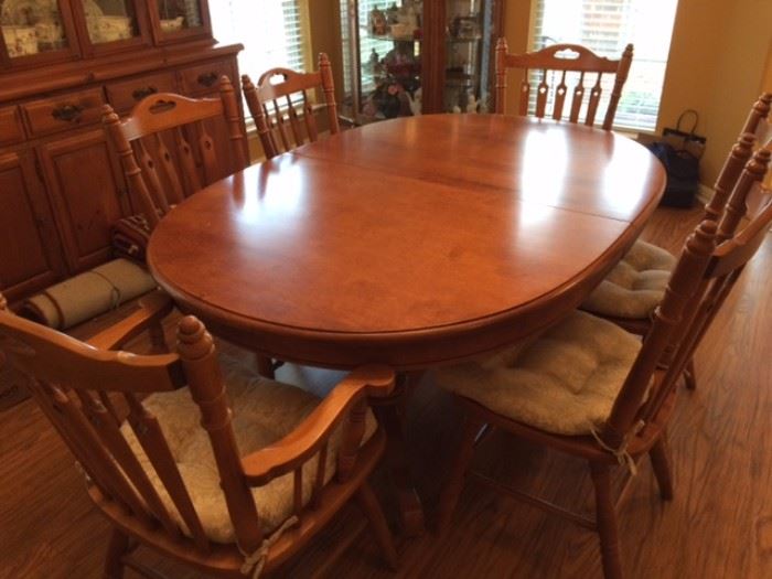 Oval dining room set with 6 chairs/cushions. Solid wood table 64" w/out leaves, extends to 92" with 2 14" leaves. Double pedestal base.