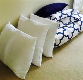 Navy and white bedding with comforter, 2 shams, small navy throw pillow, and 3 large throw pillows