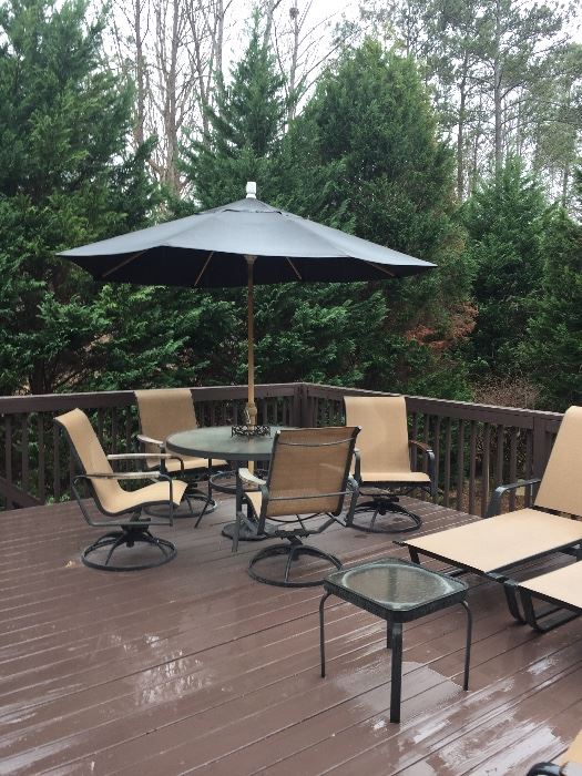 Outdoor all weather patio set. Table, umbrella stand, 4-rocking swivel chair, side table, two chaise lounges