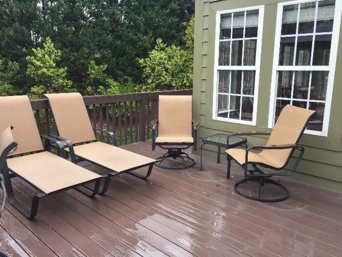 Two all weather chaise lounges, Two rocking swivel chairs with metal and glass side tables
