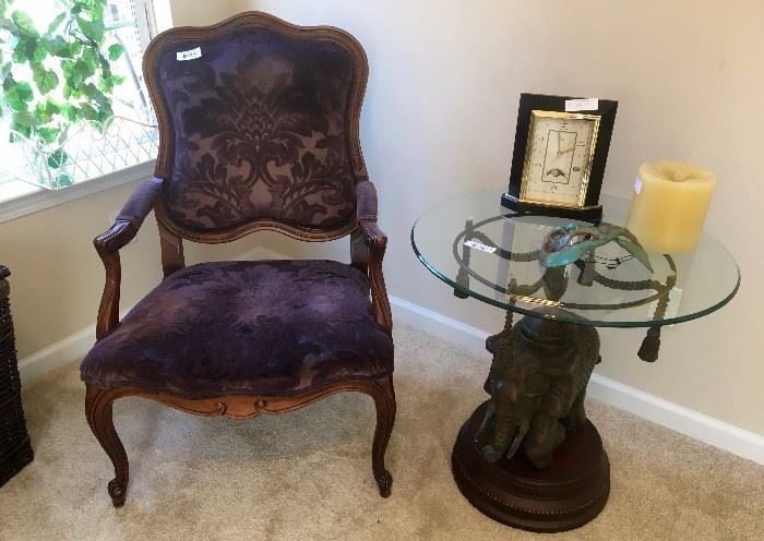 Upholstered armchair, glass topped side table. CLOCK HAS BEEN SOLD