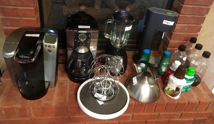 Assorted coffee makers, blender, soda stream, K-cup holder, kettle