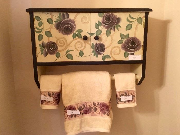 Bathroom towel rack with storage compartment