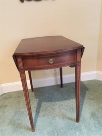 DROP-LEAF SIDE TABLE WITH BELLFLOWER AND STRING ADORNMENT