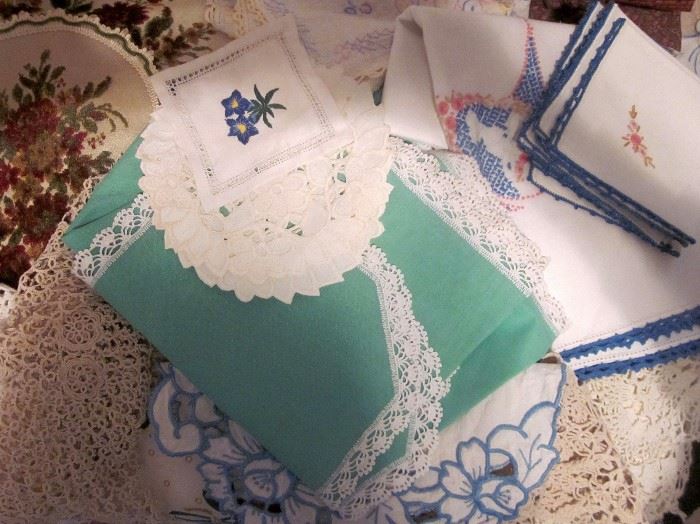 Small sampling of the vintage, hand made crocheted doilies, table runners, embroidered runners, napkins, tablecloths, etc.