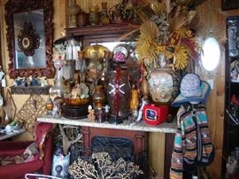 There is a beautiful Antique Fireplace Mantle behind all that stuff....and no telling what else is back there. 