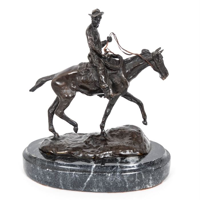 C.M. Russell Reproduction Bronze Sculpture "Will Rogers": A C.M. Russell reproduction bronze sculpture titled Will Rogers. This sculpture of a cowboy in bronze is mounted on a granite base, the bottom of which reads “Will Rogers APR/27.” The horse features a chalice brand on its right. The bronze was tested and found not to be magnetic. The pieces is incised to the top, “CM Russell”.