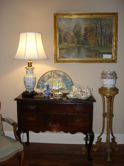 American antique lowboy with decoratives.