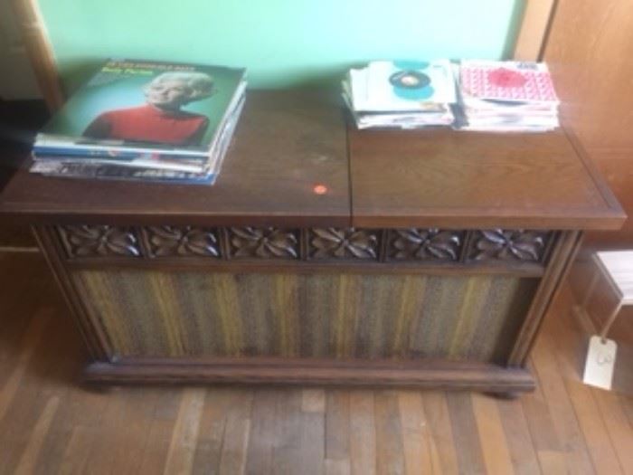 Vintage Solid State Stereo and Record Player with Records and original instruction manual.  In good working condition 17"W x 42"L x 23"T