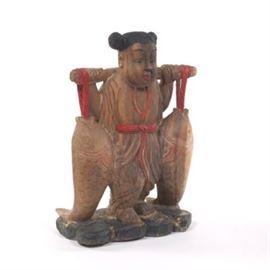 Carved Wood Sculpture of a Figure Carrying Fish
