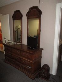 Solid cherry bureau with mirrors . . . and note the antique table radio.