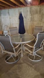 Patio set with 4 swivel chairs, umbrella, and stand