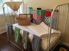 Antique iron crib, vintage textiles