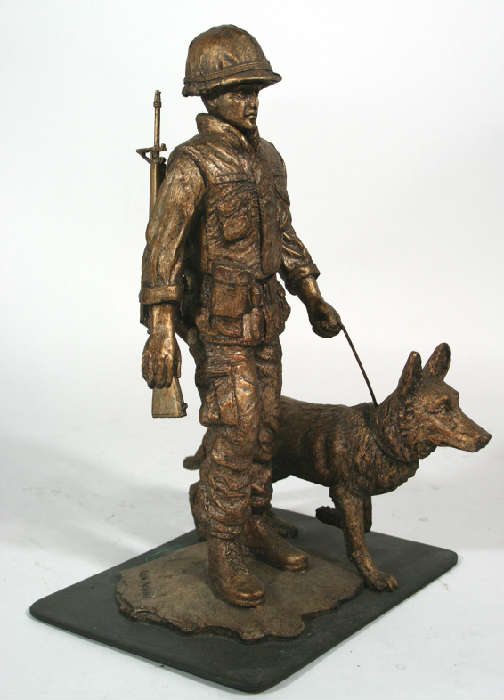 This maquette or miniature statue is cast in resin and mounted on a steel plate base. It is a miniature version of the life size bronze statue that is located at Wildlife Prairie State Park outside Peoria Illinois. The statue was commissioned by the parks founder, the late Bill Rutherford, to honor the dogs and their soldier handlers that faithfully served their country during the Vietnam conflict or war. The statue was created by Lake Forest artist Erin Mallon. Proceeds from the sale of these statues go to Wildlife Prairie State park. There are several available. They measure @ 12" tall and are mounted on a 6" x 8" steel plate base.