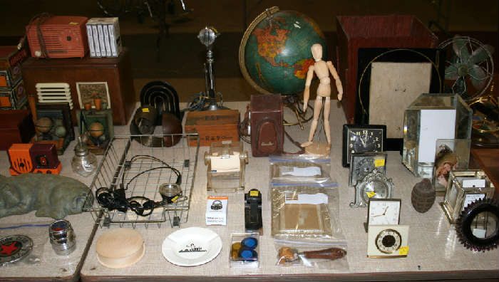 Lots of cool stuff...radio's, globe, desk microphone, desk clocks & more!