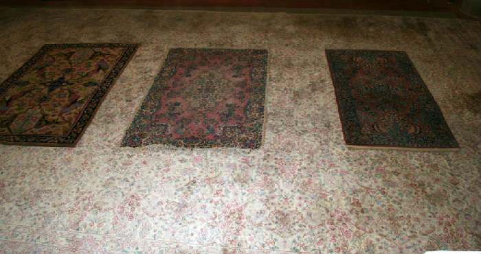 3 small old rugs on 11'5" x 18' Karastan rug.