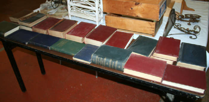 Old specialized medical reference books form early 1900's. Books with titles like "Guide to Pain" and other light reading.