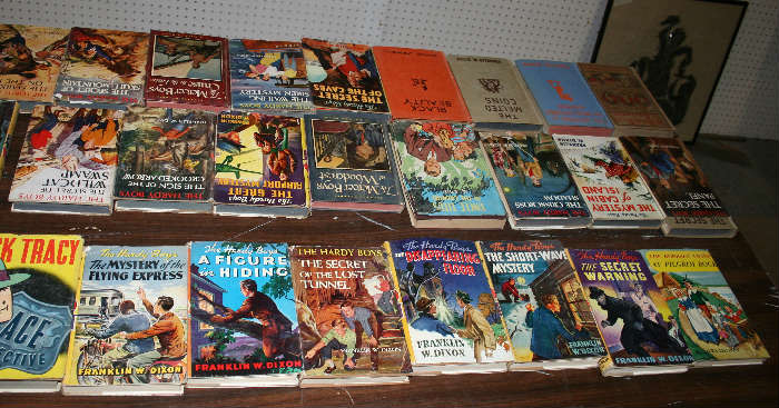 Lots of Hardy Boys books with dust jackets.