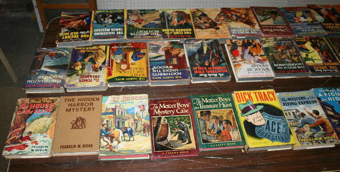 Lots of Hardy Boys books with dust jackets.