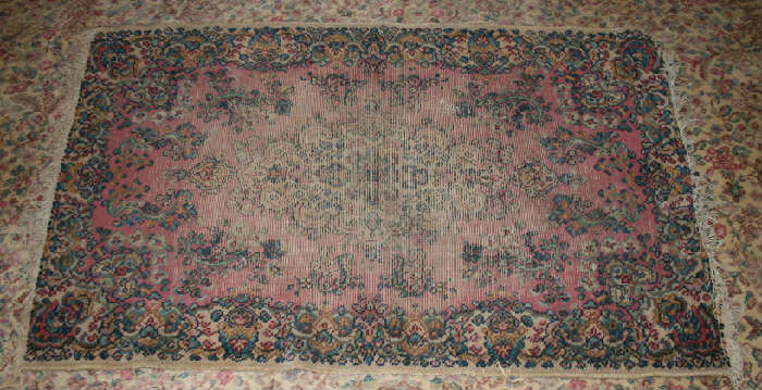 Well worn rug. 34" x 57".