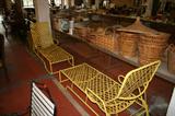 Pair of Brown Jordan yellow webbed chaise lounges and other outdoor pieces