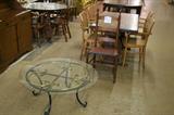 Glass top table and misc side chairs.