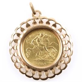 1914 British Gold Half Sovereign set in an 18K Rose Gold Pendant: A 1914 British gold half sovereign set in an 18K rose gold pendant. Features King George V on the obverse and St. George slaying a dragon on the reverse. Mintage: 7,251,000. Metal content: 92% gold. Diameter: 19 mm. Weight: 4 grams. Pendant weighs 2.9 grams without the coin. Circulated. Good condition.