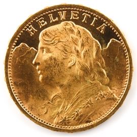 1927 Swiss Twenty Francs Gold Coin: A 1927 Swiss Twenty Francs gold coin. Mintage: 5,015,000. Metal content: 90% gold. Diameter: 21.3 mm. Weight: 6.45 grams. Very good condition.