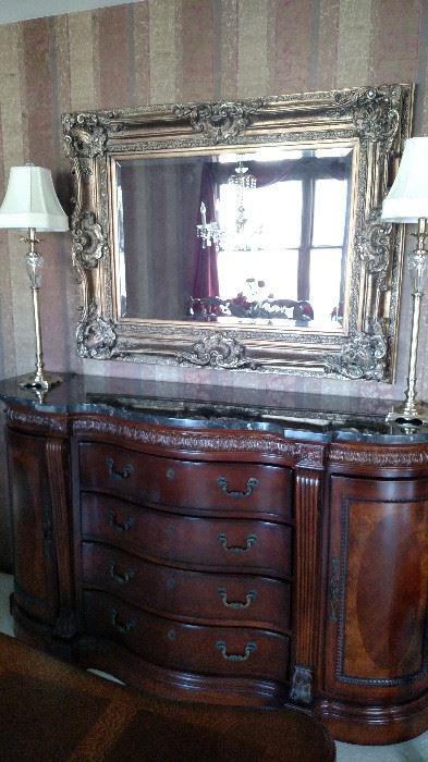 Marble top Sideboard shown with Beveled Mirror and Heavy Brass and Crystal lamps